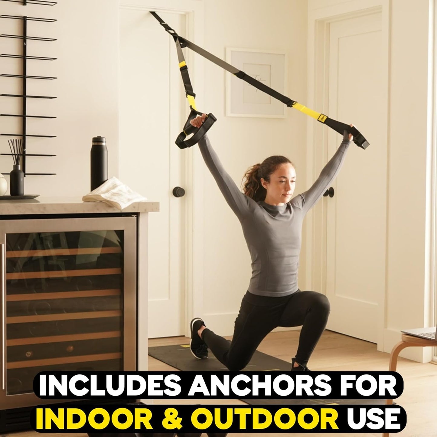 Woman exercising with TRX suspension straps in a home setting