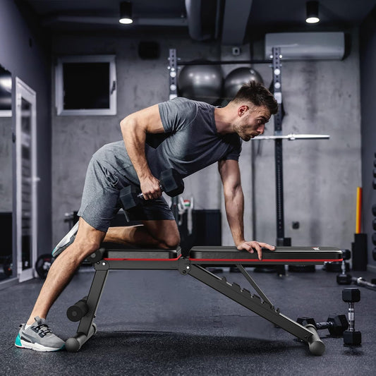Man using a weight bench in a gym setting