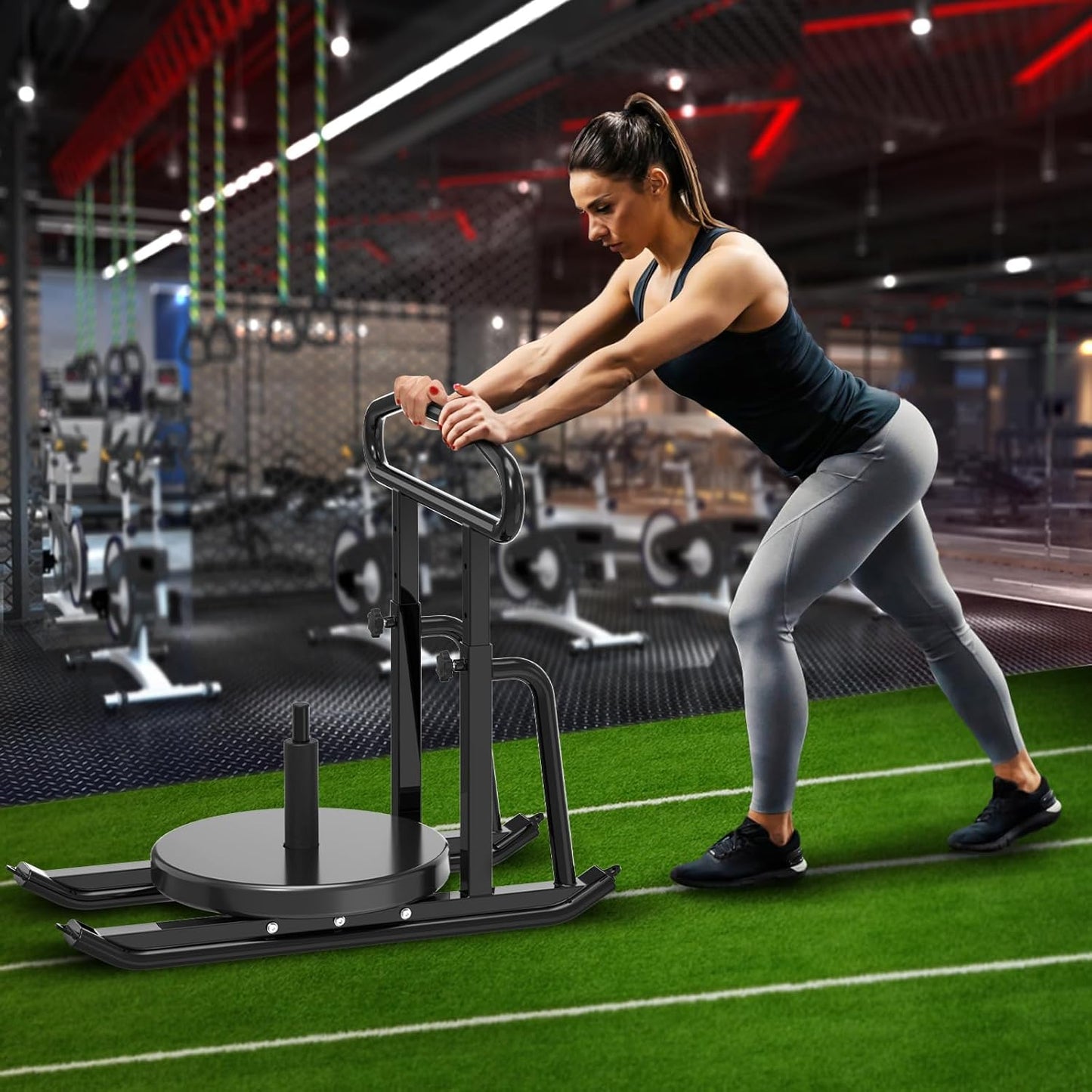 Woman exercising on a piece of exercise equipment in a gym.
